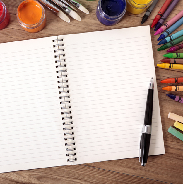 School supplies with blank writing book